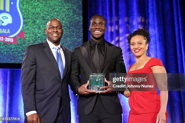 Otis Livingston, Prince Amukamara, and Sheena Wright attend the 22nd Annual Gridiron Gala at New York Hilton Midtown on May 12 in New York City.