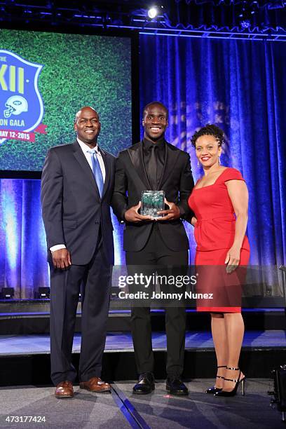 Otis Livingston, Prince Amukamara, and Sheena Wright attend the 22nd Annual Gridiron Gala at New York Hilton Midtown on May 12 in New York City.