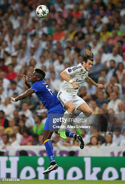 Paul Pogba of Juventus and Gareth Bale of Real Madrid compete for a header during the UEFA Champions League Semi Final, second leg match between Real...