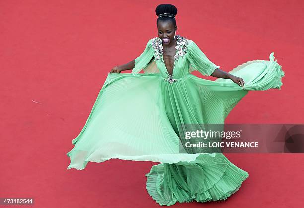 Mexican-Kenyan actress Lupita Nyong'o poses as she arrives for the opening ceremony of the 68th Cannes Film Festival in Cannes, southeastern France,...