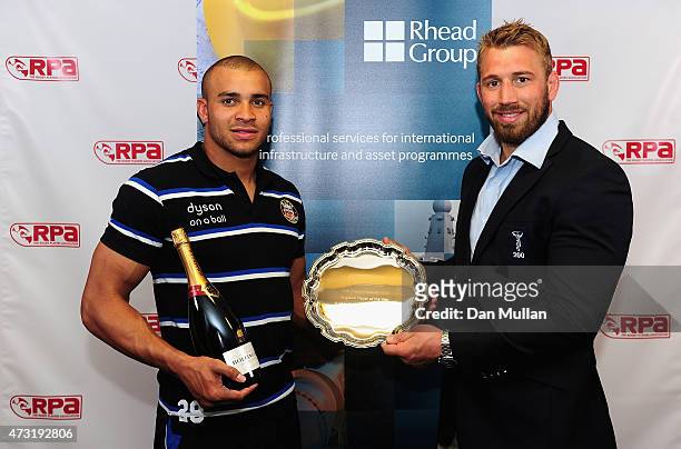 Jonathan Joseph of Bath and England receives the Rhead Group England Player of the Year award from England Captain Chris Robshaw of Harlequins...