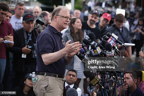 Member Robert Sumwalt briefs members of the media near the site of a train derailment accident May 13, 2015 in Philadelphia, Pennsylvania. Service...