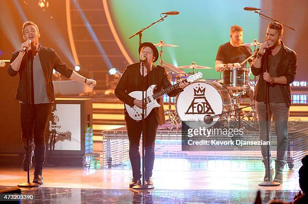 American Idol finalists Clark Beckham and Nick Fradiani perform onstage with musicians Patrick Stump and Andy Hurley of Fall Out Boy during "American...