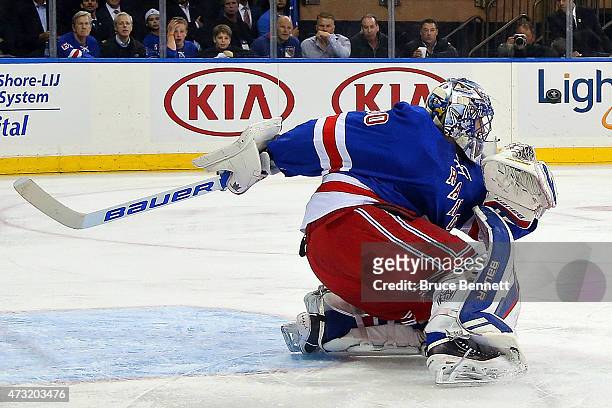 Henrik Lundqvist of the New York Rangers makes a save in the first period against the Washington Capitals in Game Seven of the Eastern Conference...