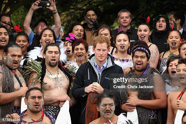 Prince Harry poses with Maori warriors as he prepares to take a Waka journey on the Whanganui River on May 14, 2015 in Wanganui, New Zealand. Prince...
