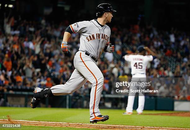 Buster Posey of the San Francisco Giants watches a two-run home run in the fifth inning off pitcher Samuel Deduno of the Houston Astros at Minute...