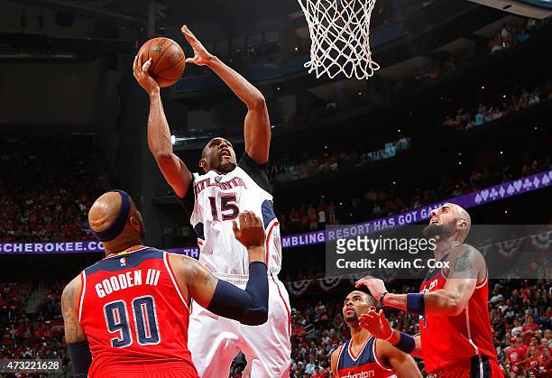Al Horford of the Atlanta Hawks shoots over Drew Gooden, Ramon Sessions, and Marcin Gortat of the Washington Wizards during Game Five of the Eastern...
