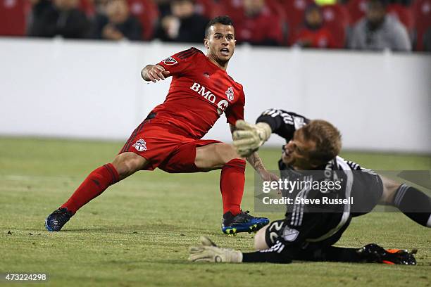 Toronto FC midfielder Sebastian Giovinco watches his shot enter the net past Montreal Impact goalkeeper Eric Kronberg as Toronto FC beats the...