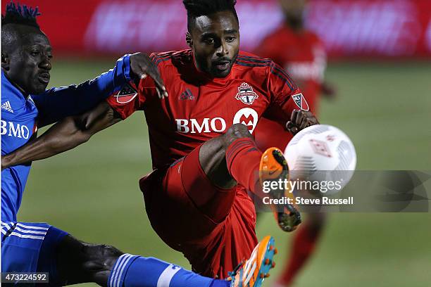 Toronto FC defender Warren Creavalle and Montreal Impact forward Dominic Oduro battle for the ball as Toronto FC beats the Montreal Impact 3-2 in the...