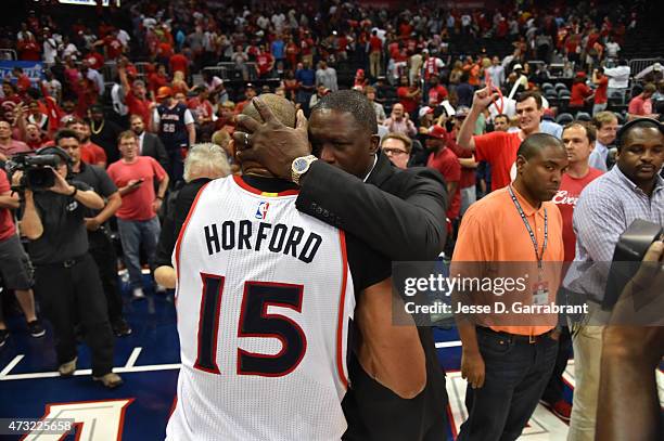 Al Horford of the Atlanta Hawks hugs Dominique Wilkins after hitting the game winning shot against the Washington Wizards in Game five of the Eastern...