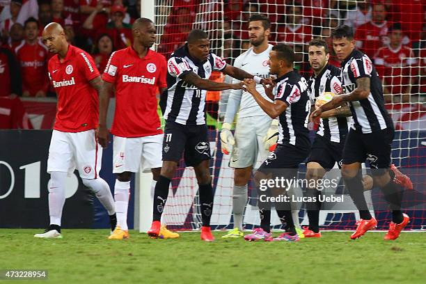 Lucas Pratto of Atletico-MG celebrates their first goal during the match Internacional x Atletico-MG as part of Copa Bridgestone Libertadores 2015...