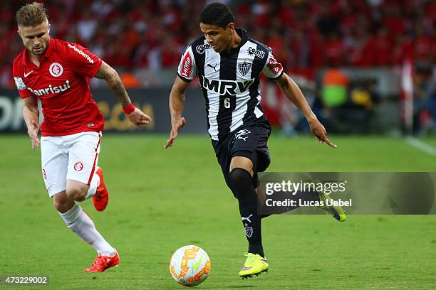 Eduardo Sasha and Juan of Internacional battles for the ball againt Douglas Santos of Atletico-MG during the match between Internacional and...