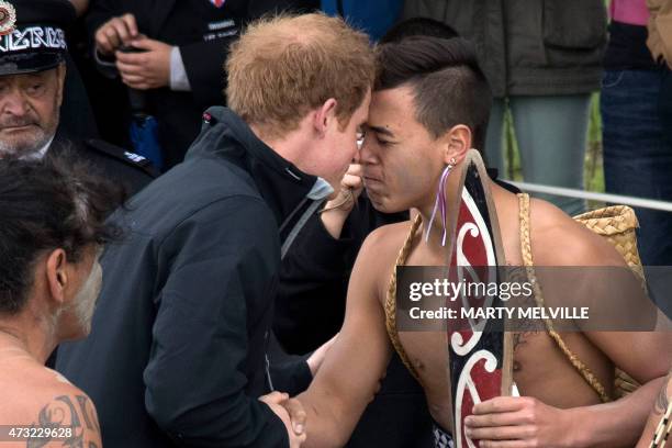 Britain's Prince Harry receives a Hongi from a Maori Warrior during a visit to the Putiki Marae in Whanganui on May 14, 2015. Prince Harry arrived in...