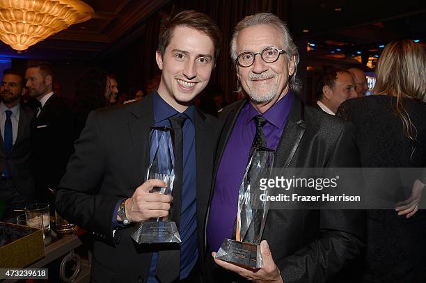 Composers Will Walden and Snuffy Walden pose with the BMI Film Music Award for "Under the Dome" during the 2015 BMI Film & Television Awards at the...