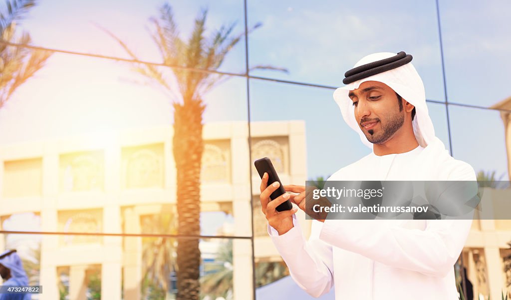 Middle Eastern businessman standing outside