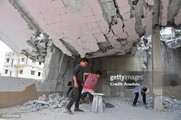 The rubble of buildings destroyed in the clashes between DAESH militants and Kurdish armed groups are seen in the center of the Syrian town of Kobani...