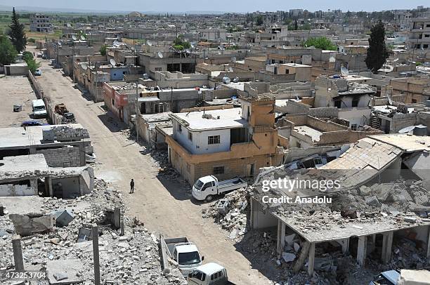 The rubble of buildings destroyed in the clashes between DAESH militants and Kurdish armed groups are seen in the center of the Syrian town of Kobani...