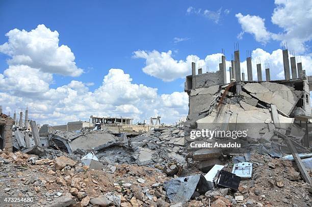 The rubble of buildings destroyed in the clashes between DAESH militants and Kurdish armed groups are seen in the center of the Syrian town of Kobani...