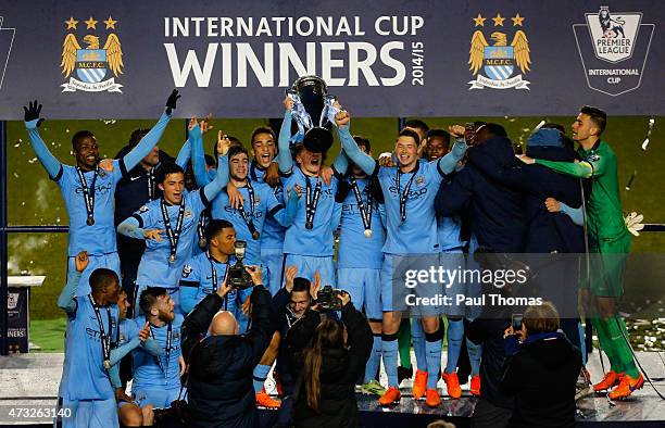 Manchester City players celebrate with the trophy after the Premier League International Cup Final match between Manchester City and FC Porto at the...