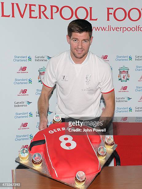 Steven Gerrard captain of Liverpool with a cake presented to him during a Press Conference at Melwood Training Ground on May 14, 2015 in Liverpool,...