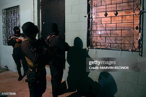 Member of the Salvadorean National Civil Police participates in an operation in search of 18th Street gang members in Ilopango, 11 km East of San...