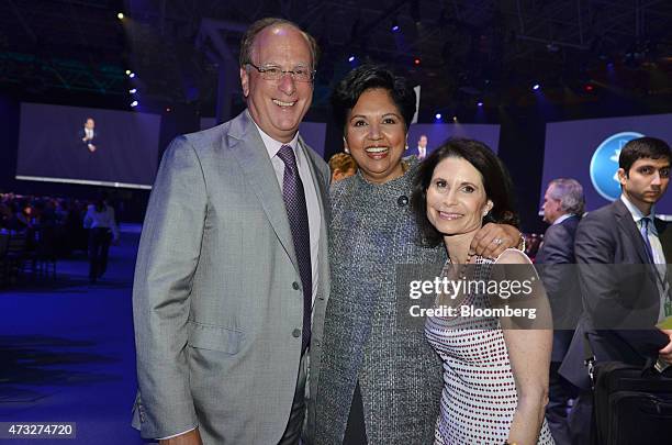 Indra Nooyi, chief executive officer of PepsiCo Inc., center, Laurence "Larry" Fink, chief executive officer of BlackRock Inc., left, and Lori Fink...