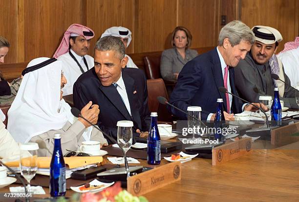 President Barack Obama talks to Sheikh Sabah Al-Ahmed Al-Jaber Al-Sabah, Amir of the State of Kuwait, while Secretary of State John Kerry talks to...