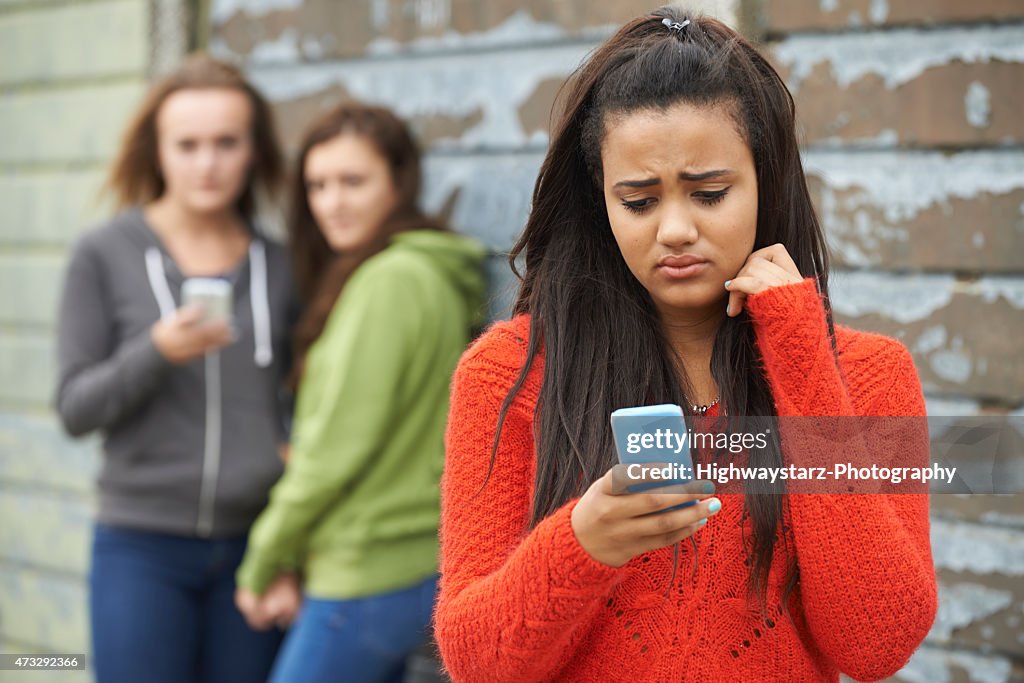 Teenage Girl Being Bullied By Text Message