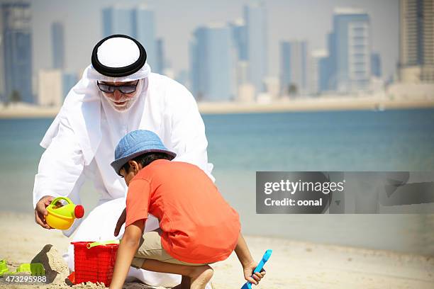 grandfather and grandson enjoying their leisure time - saudi grandfather stock pictures, royalty-free photos & images