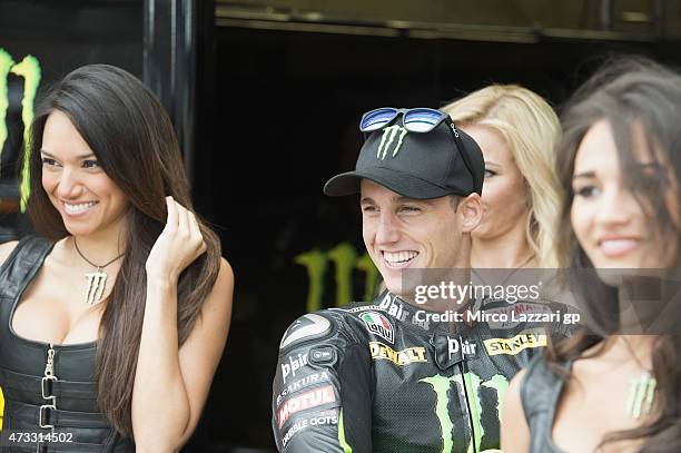 Pol Espargaro of Spain and Monster Yamaha Tech 3 poses with the grid girl in pit before the MotoGp of France - Press Conference on May 14, 2015 in...