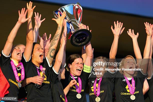 Kerstin Garefrekes of 1. FFC Frankfurt lifts the UEFA Women's Champions League winners trophy after the UEFA Women's Champions League final match...