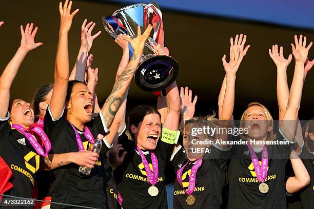 Kerstin Garefrekes of 1. FFC Frankfurt lifts the UEFA Women's Champions League winners trophy after the UEFA Women's Champions League final match...