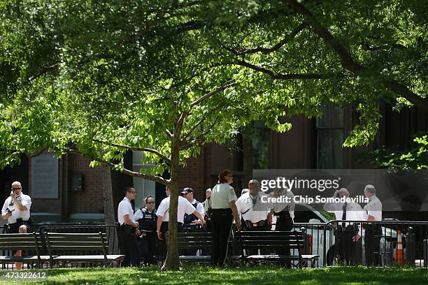 Investigators from the U.S. Park Police, the U.S. Secret Service, the D.C. Metropolitan Police Department and other law enforcement agencies collect...