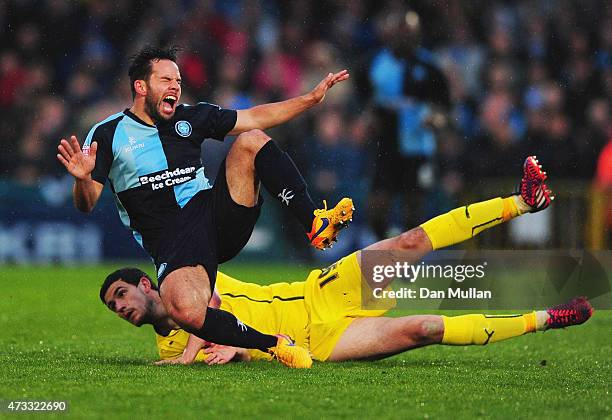 Anthony O'Connor of Plymouth Argyle tackles Sam Wood of Wycombe Wanderers during the Sky Bet League Two Playoff semi final match between Wycombe...