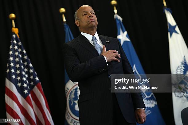 Homeland Security Secretary Jeh Johnson places his hand over his heart during the presentation of colors before presenting the DHS Secretary's Award...