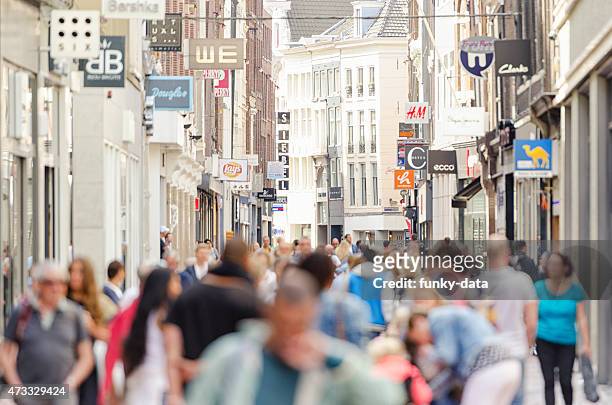 kalverstraat shopping street amsterdam city center - high street stock pictures, royalty-free photos & images