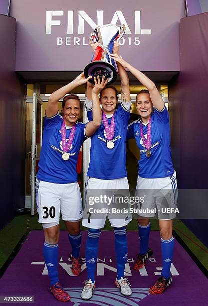 Anne-Kathrine Kremer, Desiree Schumann and Anke Preuss of Frankfurt celebrate with the cup after winning the UEFA Women's Champions League final...