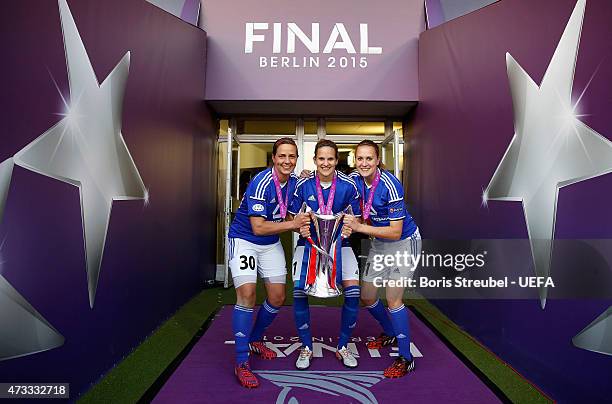 Anne-Kathrine Kremer, Desiree Schumann and Anke Preuss of Frankfurt celebrate with the cup after winning the UEFA Women's Champions League final...