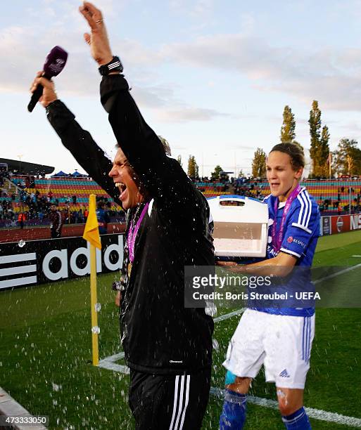 Head coach Colin Bell of Frankfurt gets showered by Desiree Schumann after winning the UEFA Women's Champions League final match between 1. FFC...