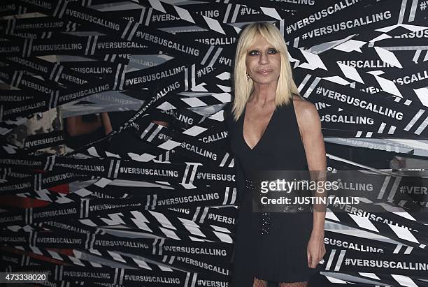 Italian designer Donatella Versace arrives for the launch party of Versace's diffusion label at the Old Truman Brewery in London on May 14, 2015. AFP...
