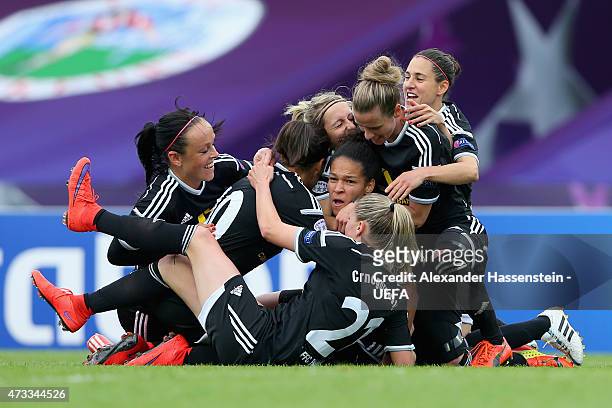 Kerstin Garefrekes of 1. FFC Frankfurt celebrates scoring the opening goal with her team mates during the UEFA Women's Champions League final match...