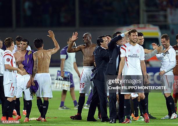 Sevilla's players celebrate their victory at the end of the UEFA Europa League second leg semi-final football match Fiorentina vs Sevilla at the...