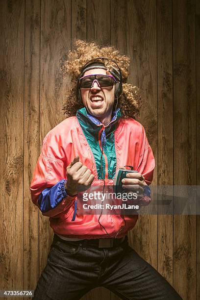 fashion of nineteen eighties and nineties with walkman - track suit stock pictures, royalty-free photos & images