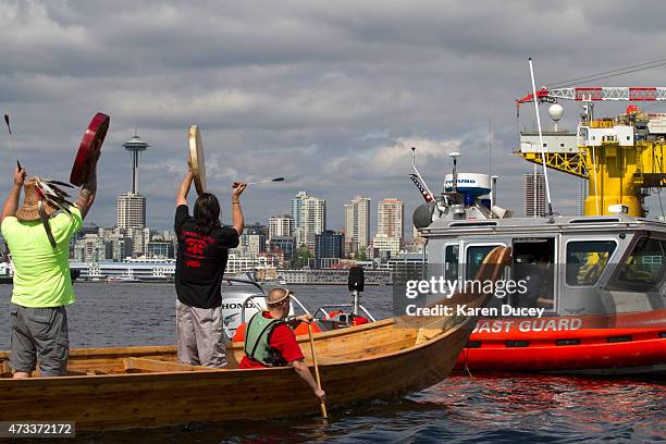 Environmental activists from the Duwamish Tribe protest the arrival of the Polar Pioneer, an oil drilling rig owned by Shell Oil, as it arrives on...