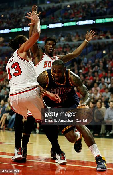 LeBron James of the Cleveland Cavaliers drives against Joakim Noah of the Chicago Bulls in the first quarter during Game Six of the Eastern...