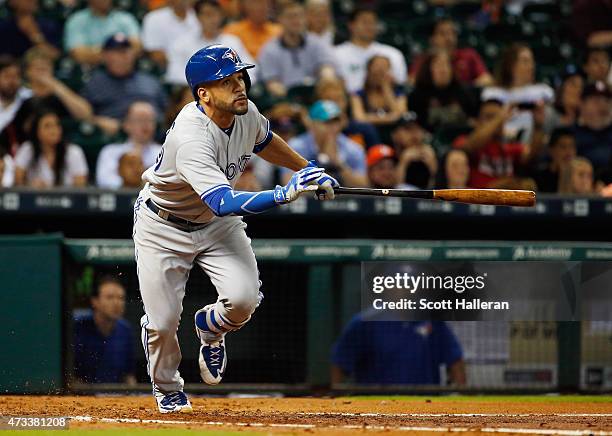 Devon Travis of the Toronto Blue Jays watches his RBI double in the third inning of their game against the Houston Astros at Minute Maid Park on May...