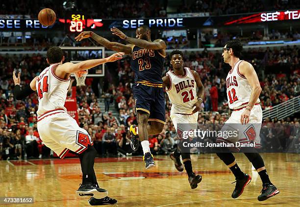 LeBron James of the Cleveland Cavaliers passes against Nikola Mirotic of the Chicago Bulls in the second quarter during Game Six of the Eastern...