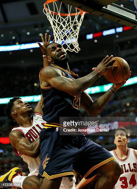 LeBron James of the Cleveland Cavaliers goes up against Jimmy Butler of the Chicago Bulls in the second quarter during Game Six of the Eastern...