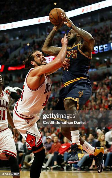 LeBron James of the Cleveland Cavaliers goes up against Joakim Noah of the Chicago Bulls in the second quarter during Game Six of the Eastern...