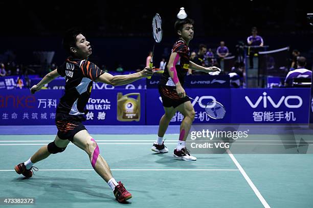 Goh V Shem and Tan Wee Kiong of Malaysia compete against Lee Yong Dae and Yoo Yeon Seong of South Korea during men's doubles quarter-final match on...